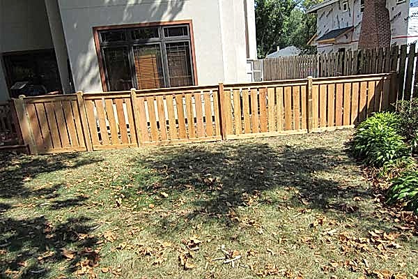 Good Neighbor With Privacy Wooden Fencing at the backyard.