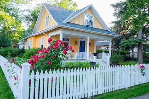 White wooden fencing in front of bungalow, IL