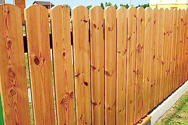 New wooden fence in the garden.